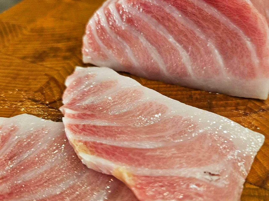 Marbled bluefin toro resting on a wooden board